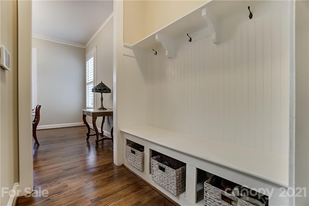 829 Elswick Court Fort Mill, SC 29708 - Photo 27 of 48 a view of a hallway with wooden floor and staircase