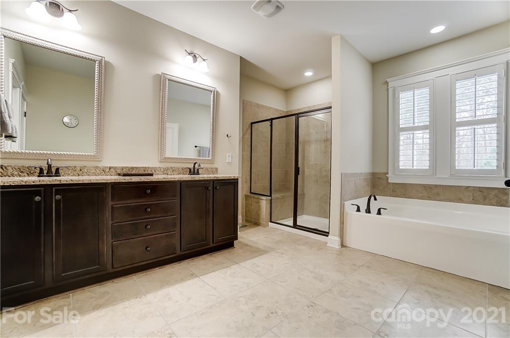 829 Elswick Court Fort Mill, SC 29708 - Photo 30 of 48 a spacious bathroom with a tub sink and mirror