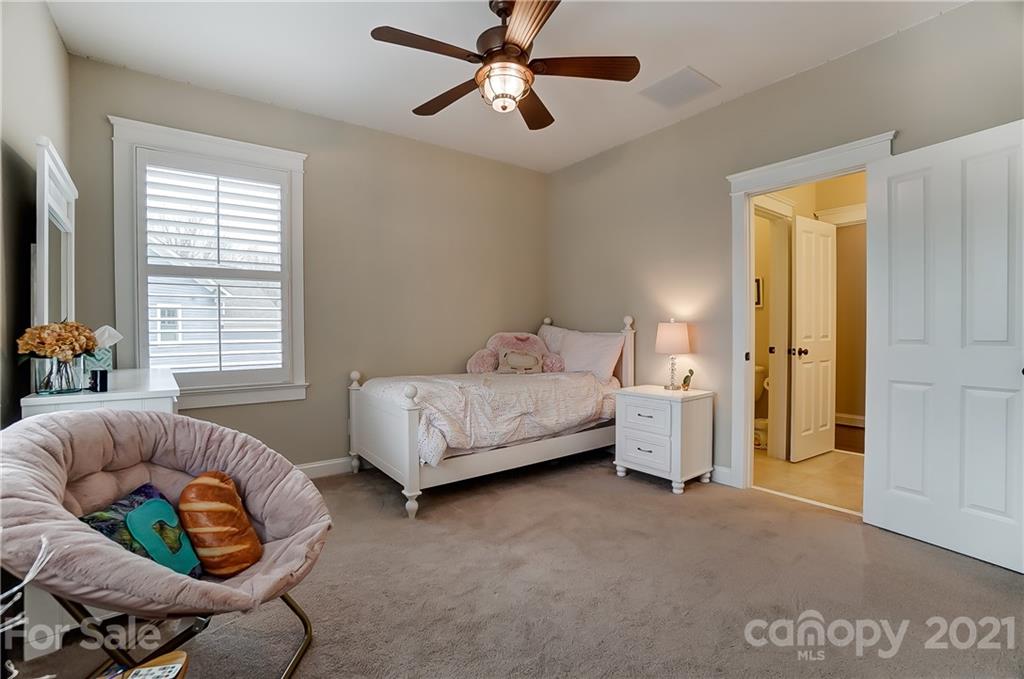 829 Elswick Court Fort Mill, SC 29708 - Photo 34 of 48 a bedroom with a bed and window