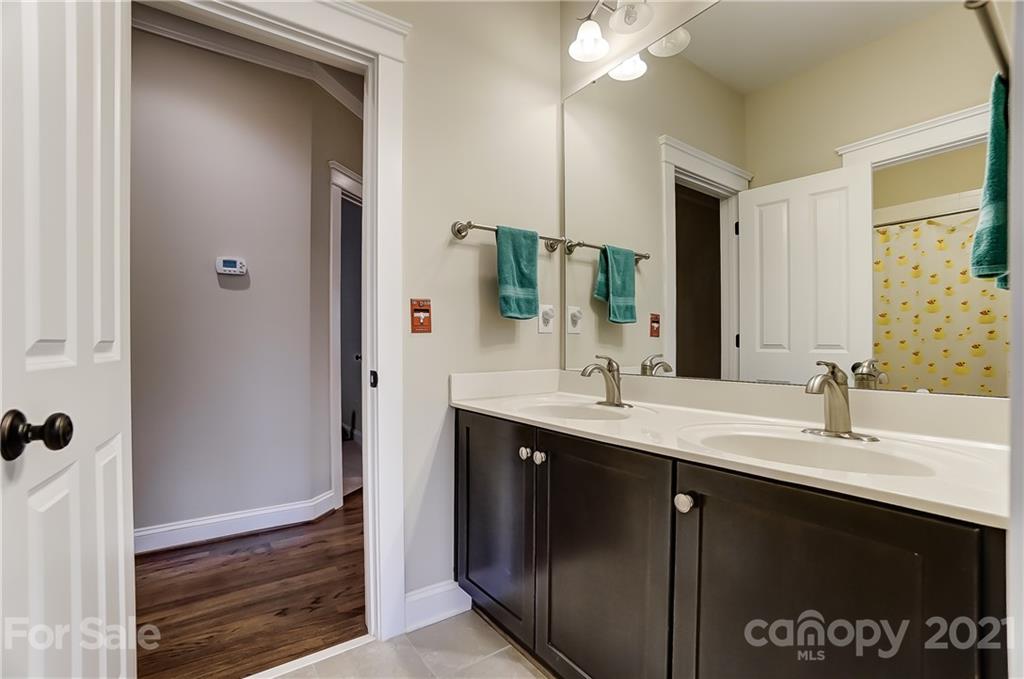 829 Elswick Court Fort Mill, SC 29708 - Photo 36 of 48 a bathroom with a sink vanity and mirror