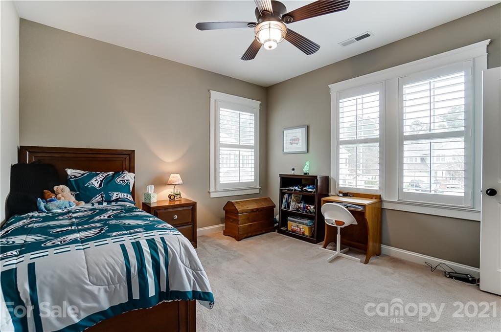 829 Elswick Court Fort Mill, SC 29708 - Photo 37 of 48 a bedroom with furniture and a window
