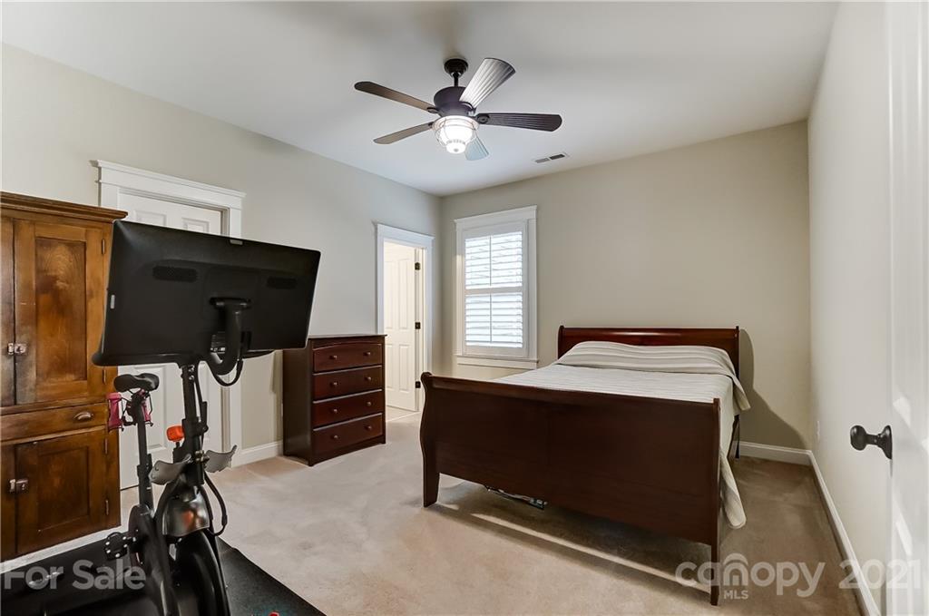 829 Elswick Court Fort Mill, SC 29708 - Photo 39 of 48 a bedroom with furniture and a window