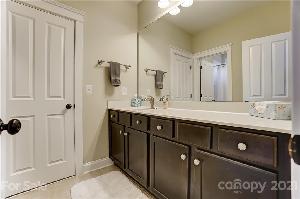 829 Elswick Court Fort Mill, SC 29708 - Photo 40 of 48 a bathroom with a double vanity sink and a mirror