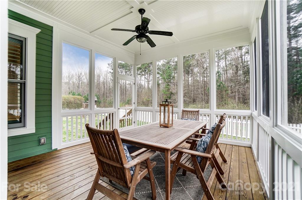 829 Elswick Court Fort Mill, SC 29708 - Photo 42 of 48 a view of a dining room with furniture window and wooden floor
