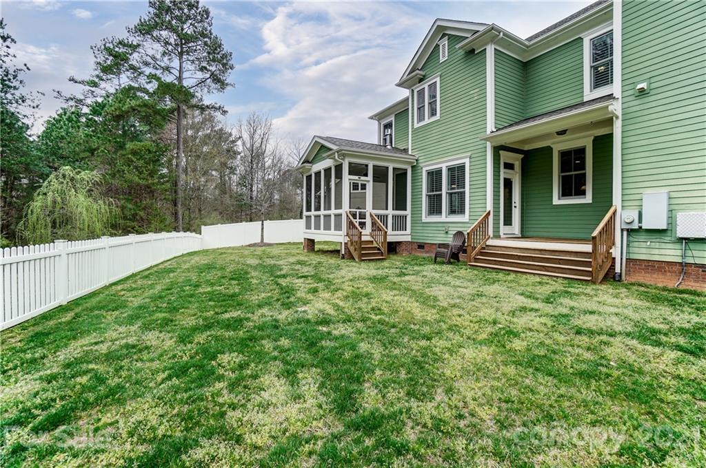 829 Elswick Court Fort Mill, SC 29708 - Photo 43 of 48 a view of a house with a yard and sitting area