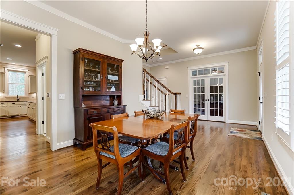 829 Elswick Court Fort Mill, SC 29708 - Photo 7 of 48 a view of a dining room with furniture window and wooden floor