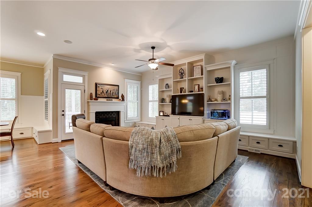 829 Elswick Court Fort Mill, SC 29708 - Photo 10 of 48 a living room with furniture a fireplace and a large window