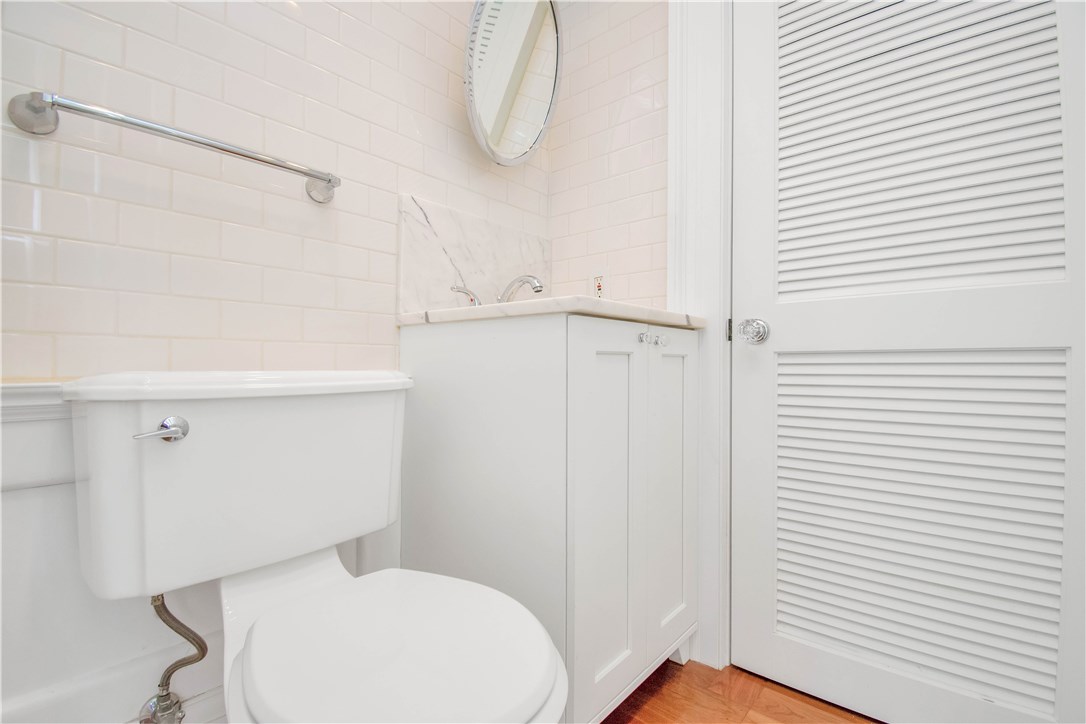 367 Benefit Street, Unit 3 Providence, RI 02903 - Photo 13 of 26 guest half-bath featuring glass & chrome door knobs and cabinet hardware. Located off laundry room/breezeway.