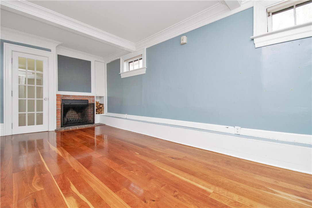 367 Benefit Street, Unit 3 Providence, RI 02903 - Photo 15 of 26 Master Suite with wood-burning fireplace. Note glass doors with glass/chrome knob hardware.