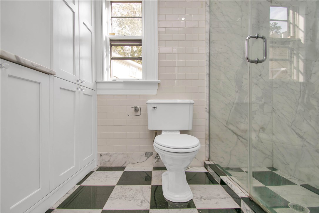 367 Benefit Street, Unit 3 Providence, RI 02903 - Photo 20 of 26 Note: floor-to-ceiling subway tile, marble and glass shower enclosure, glass/chrome cabinet hardware