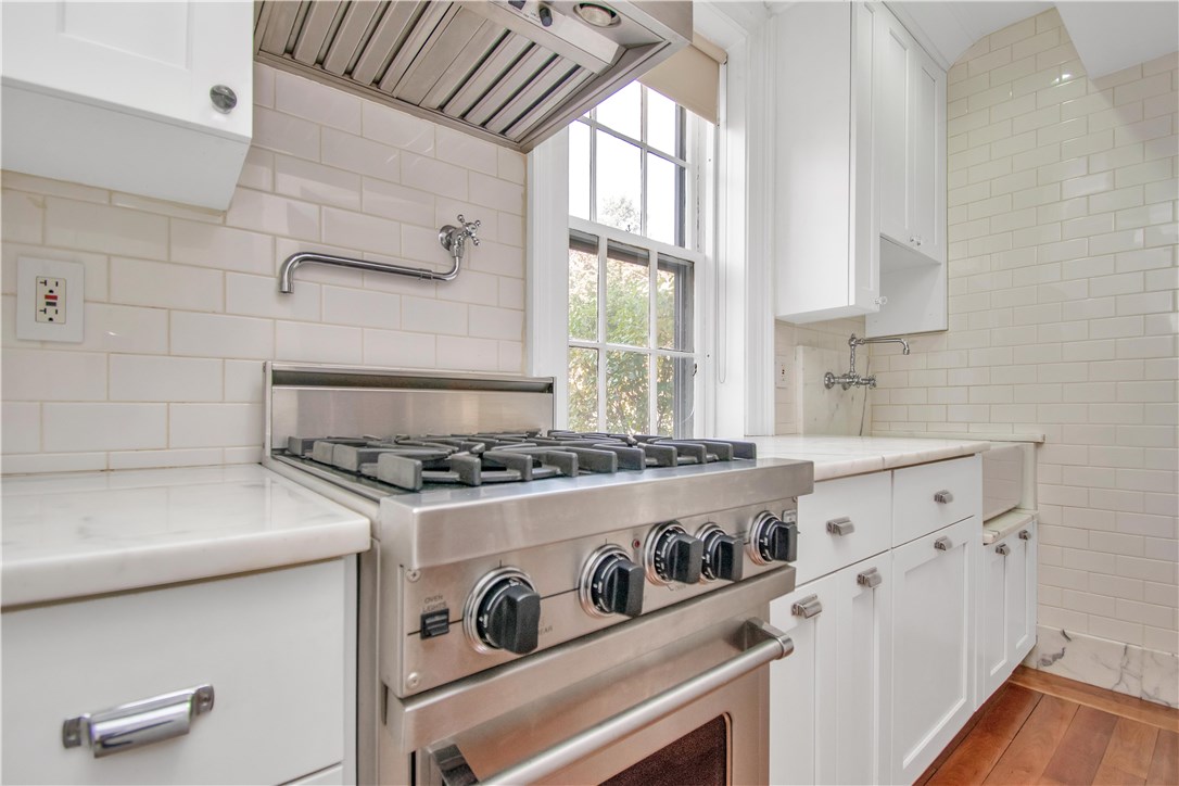 367 Benefit Street, Unit 3 Providence, RI 02903 - Photo 8 of 26 Marble counter top, custom cabinetry, and paneled/hidden dishwasher