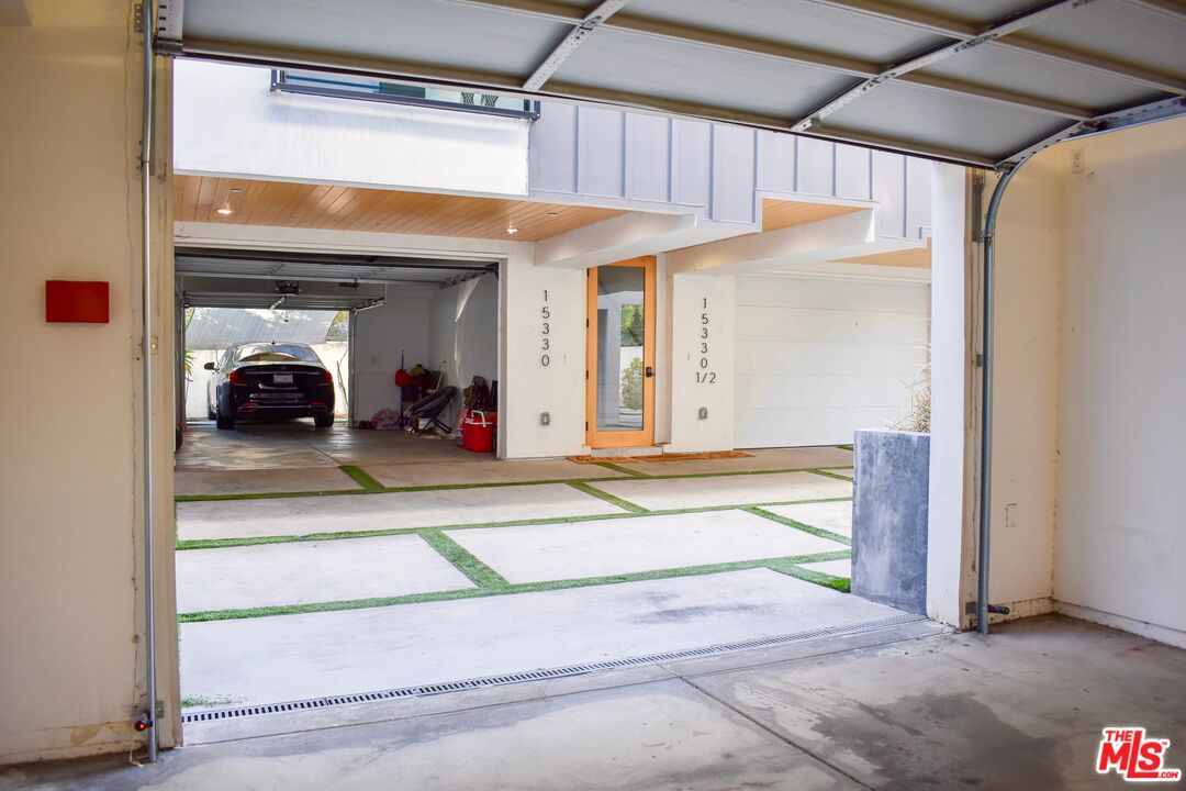 15328 Weddington Street, Unit 1 Sherman Oaks, CA 91411 - Photo 11 of 13 a view of a room that has a bed and a large mirror