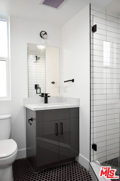 15328 Weddington Street, Unit 1 Sherman Oaks, CA 91411 - Photo 7 of 13 a bathroom with a sink toilet and shower