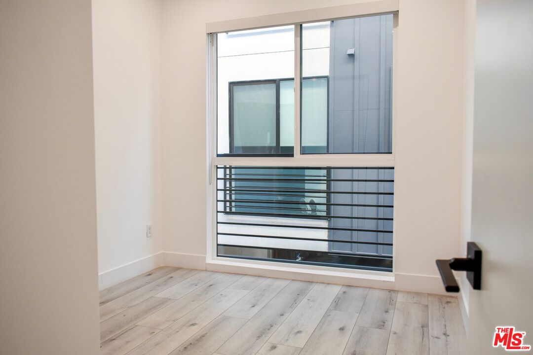 15328 Weddington Street, Unit 1 Sherman Oaks, CA 91411 - Photo 8 of 13 a view of a small space with wooden floor