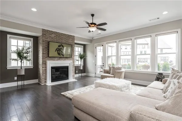 a living room with furniture fireplace and window