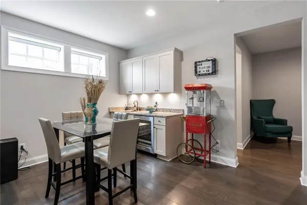 a kitchen with a table and chairs