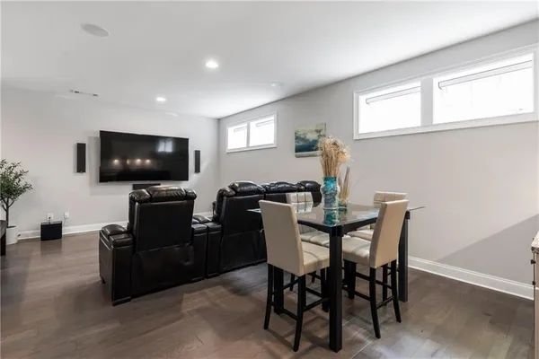 a view of a livingroom with furniture and a flat screen tv