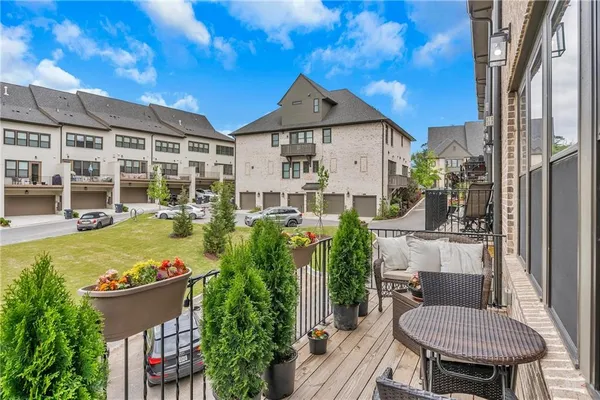 a view of a house with pool and chairs