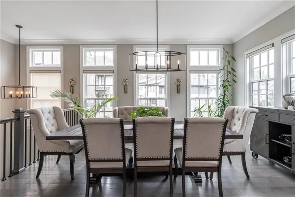 a view of a dining room with furniture windows and wooden floor