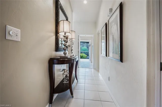 a view of a hallway with seating area