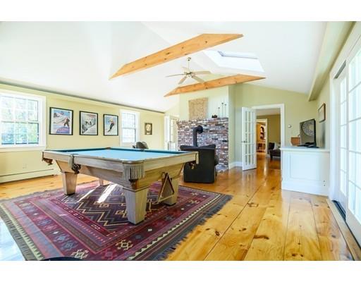 25 Maple Avenue Boxford, MA 01921 - Photo 20 of 36 a living room with furniture a table and kitchen view
