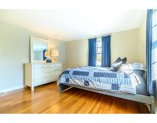 25 Maple Avenue Boxford, MA 01921 - Photo 21 of 36 a bedroom with a bed next to a window with outer view