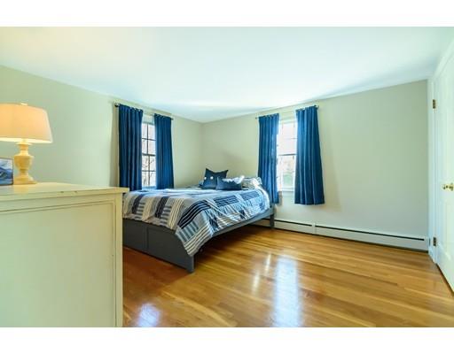 25 Maple Avenue Boxford, MA 01921 - Photo 22 of 36 a bedroom with a bed and a potted plant on dresser