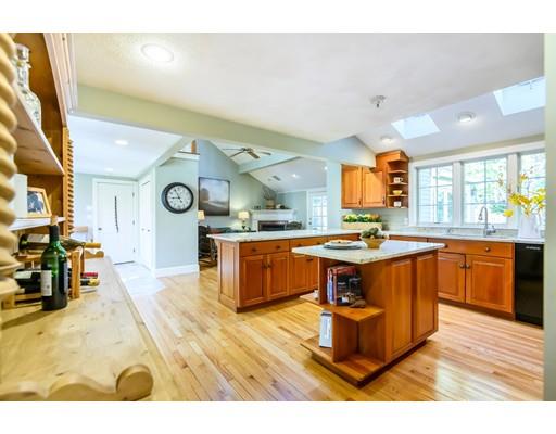 25 Maple Avenue Boxford, MA 01921 - Photo 5 of 36 a large kitchen with stainless steel appliances kitchen island granite countertop a large counter top and sink
