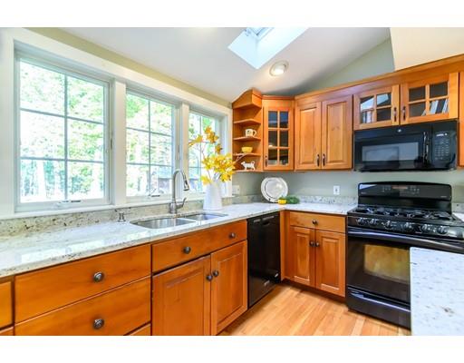 25 Maple Avenue Boxford, MA 01921 - Photo 7 of 36 a kitchen with stainless steel appliances granite countertop a stove sink and cabinets