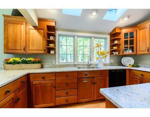 25 Maple Avenue Boxford, MA 01921 - Photo 8 of 36 a kitchen with a sink window and cabinets