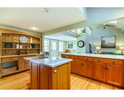 25 Maple Avenue Boxford, MA 01921 - Photo 9 of 36 a kitchen with stainless steel appliances granite countertop a sink and cabinets