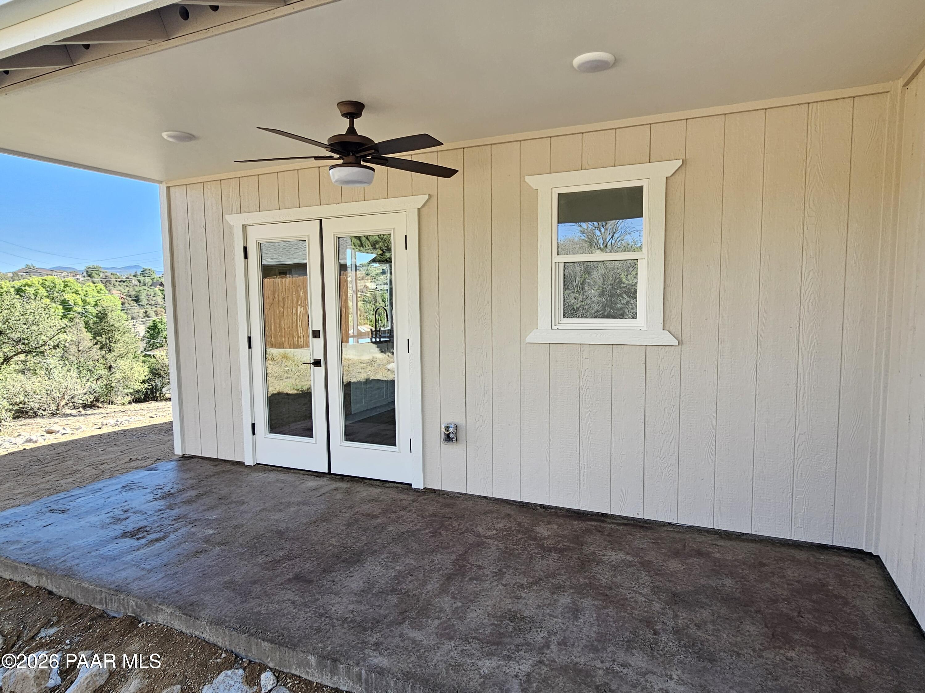 4920 East Amber Road Prescott, AZ 86301 - Photo 38 of 38 an empty room with wooden floor fan and windows