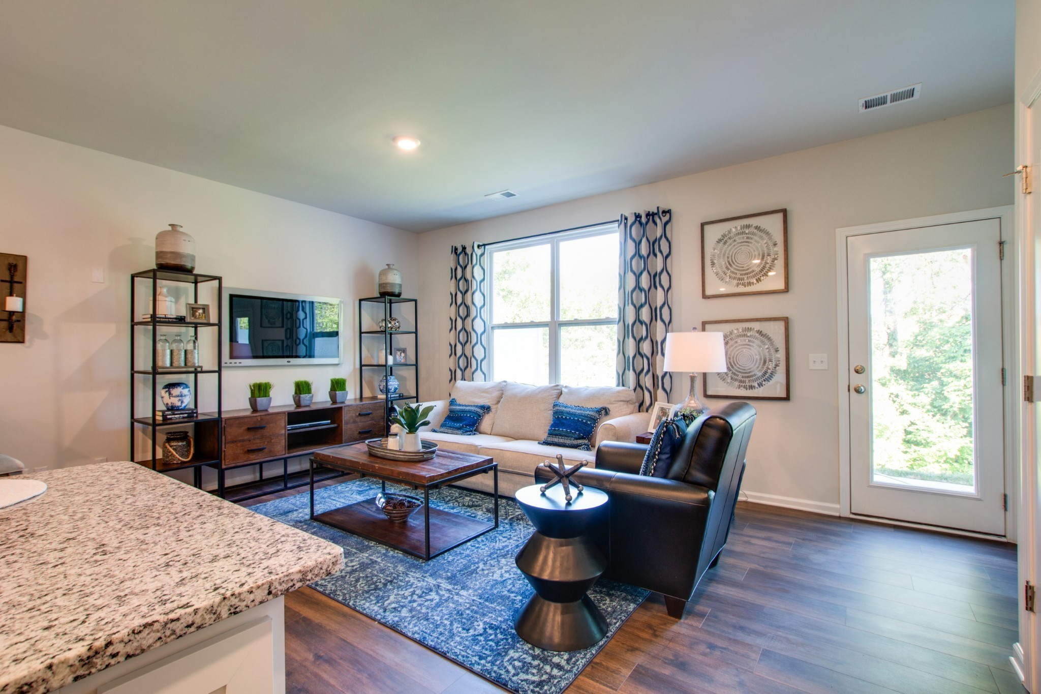 642 Longtail Lane Lebanon, TN 37090 - Photo 12 of 29 a living room with furniture and a flat screen tv