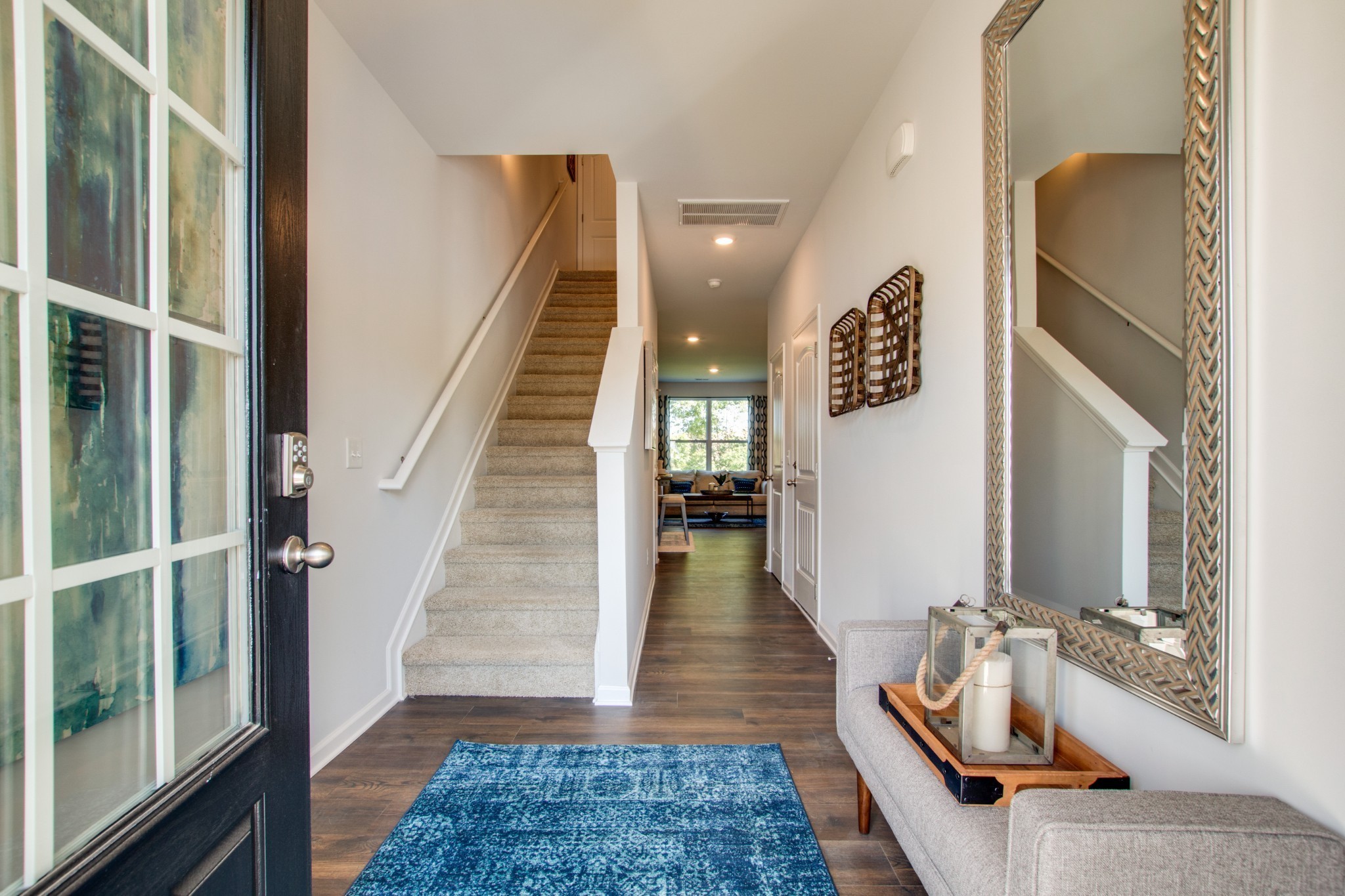 642 Longtail Lane Lebanon, TN 37090 - Photo 6 of 29 a hallway with wooden floor and furniture
