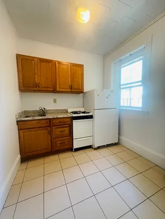 a kitchen with a cabinets and appliances