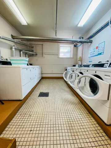 a kitchen with a sink a stove and cabinets
