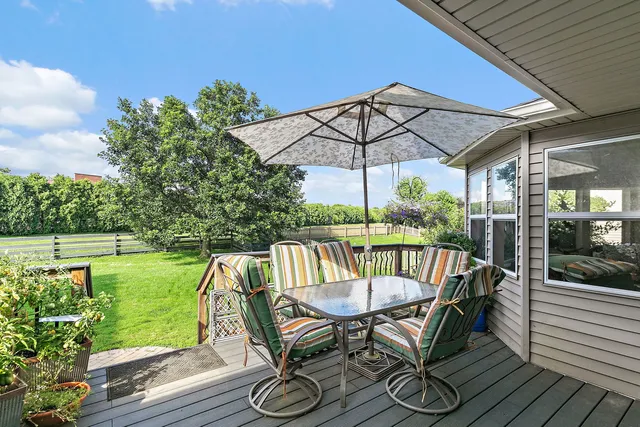 a view of a house with a backyard and garden