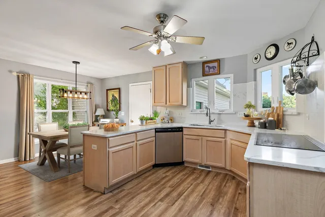 a kitchen with a sink stove and cabinets