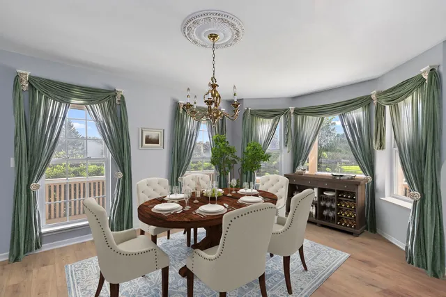 a view of a dining room with furniture and window