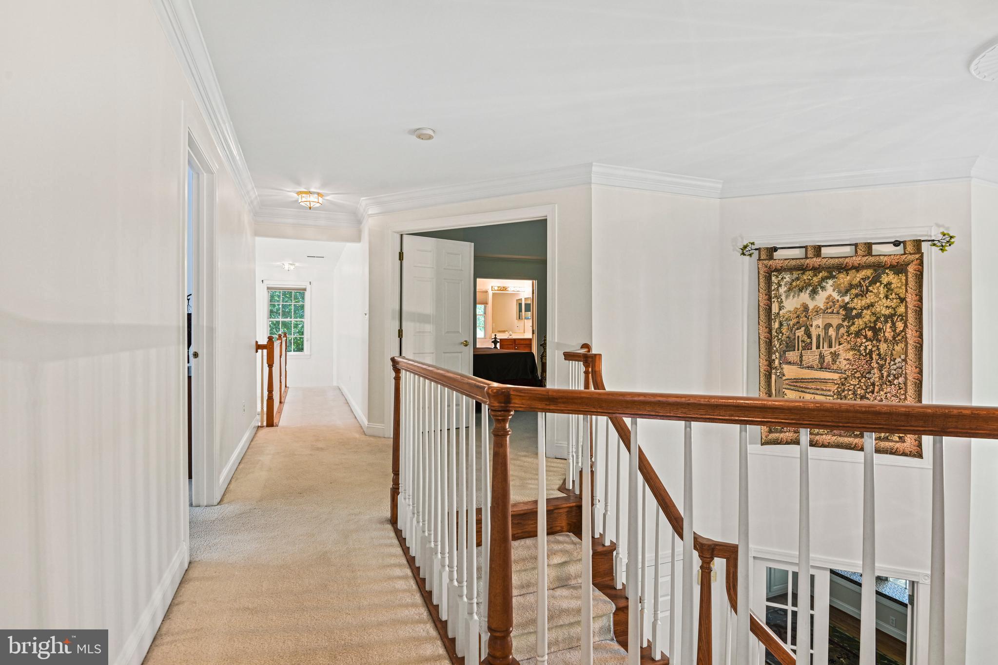 10509 Dunn Meadow Road Vienna, VA 22182 - Photo 23 of 81 a view of a hallway with wooden floor and windows