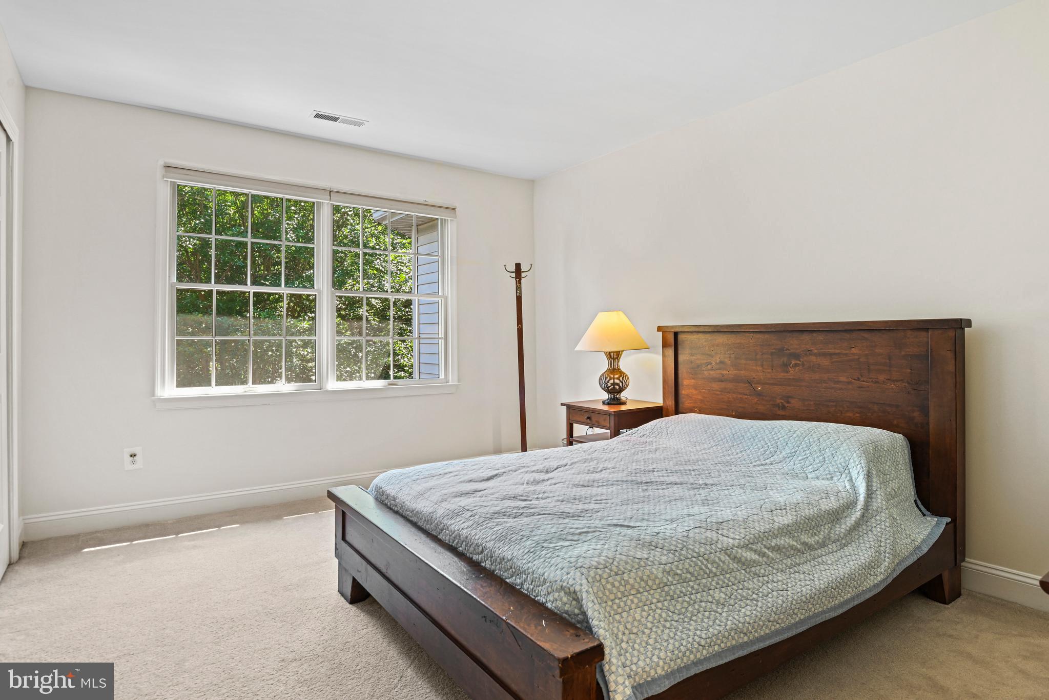 10509 Dunn Meadow Road Vienna, VA 22182 - Photo 33 of 81 a bedroom with a bed and window