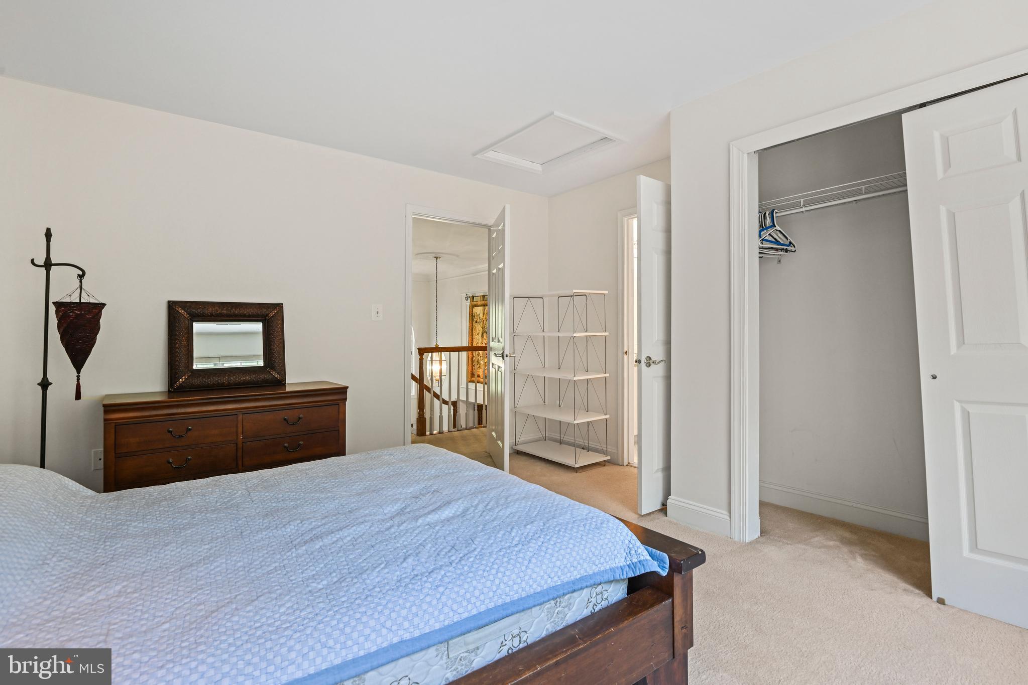10509 Dunn Meadow Road Vienna, VA 22182 - Photo 34 of 81 a bedroom with a bed and wooden floor