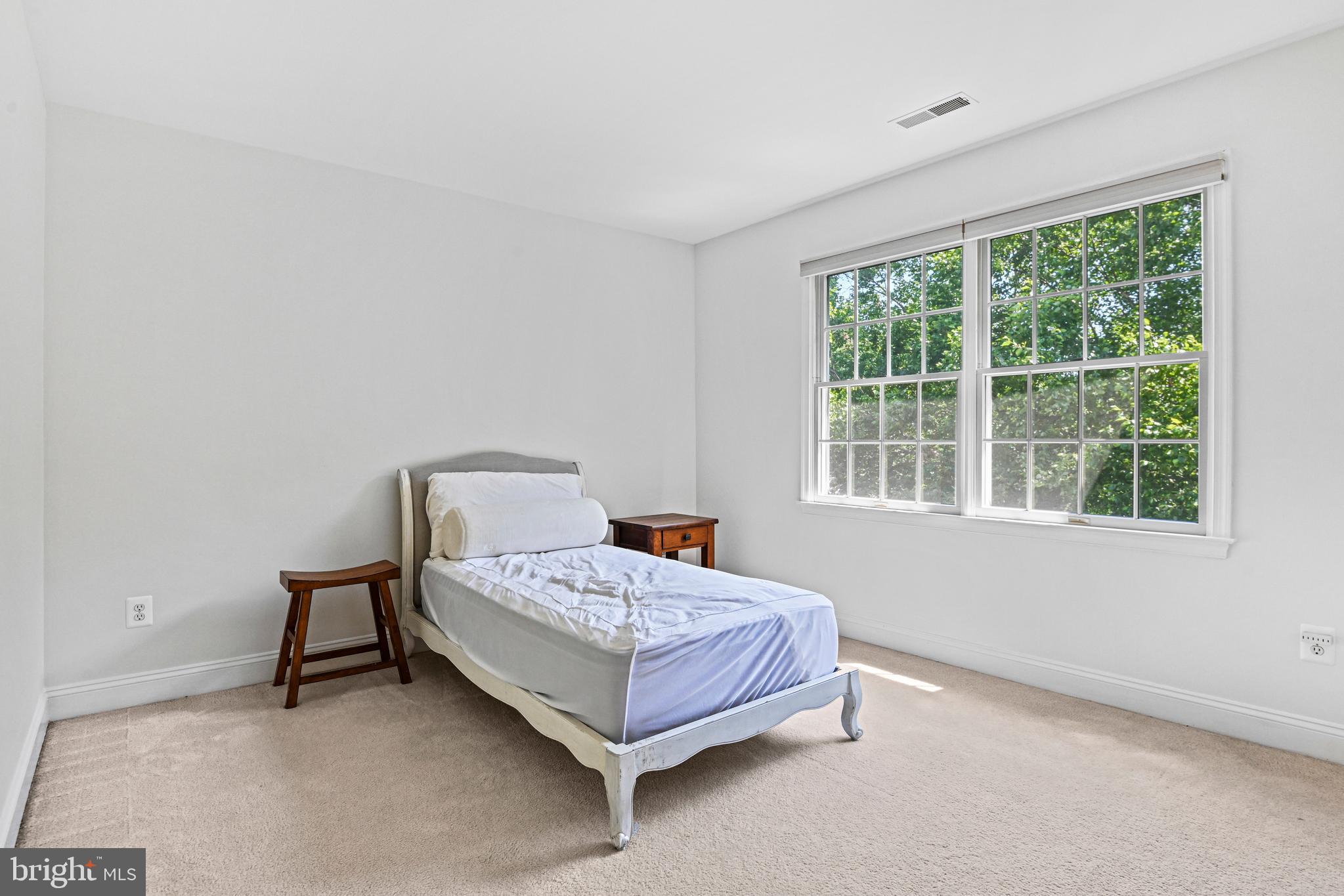 10509 Dunn Meadow Road Vienna, VA 22182 - Photo 37 of 81 a bedroom with a bed and a window