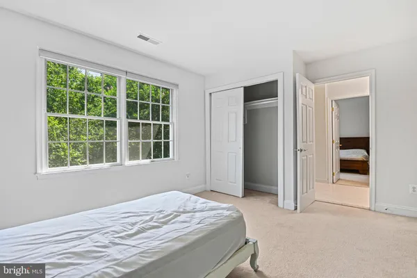 a bathroom with a shower and a window