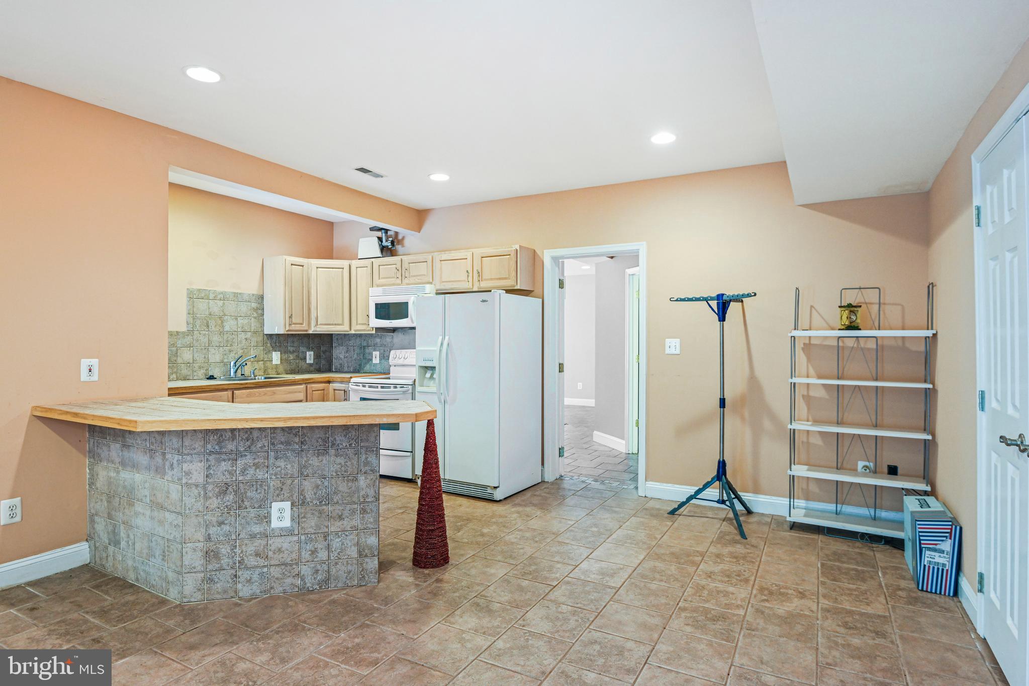 10509 Dunn Meadow Road Vienna, VA 22182 - Photo 52 of 81 a view of kitchen with refrigerator cabinets and outdoor view