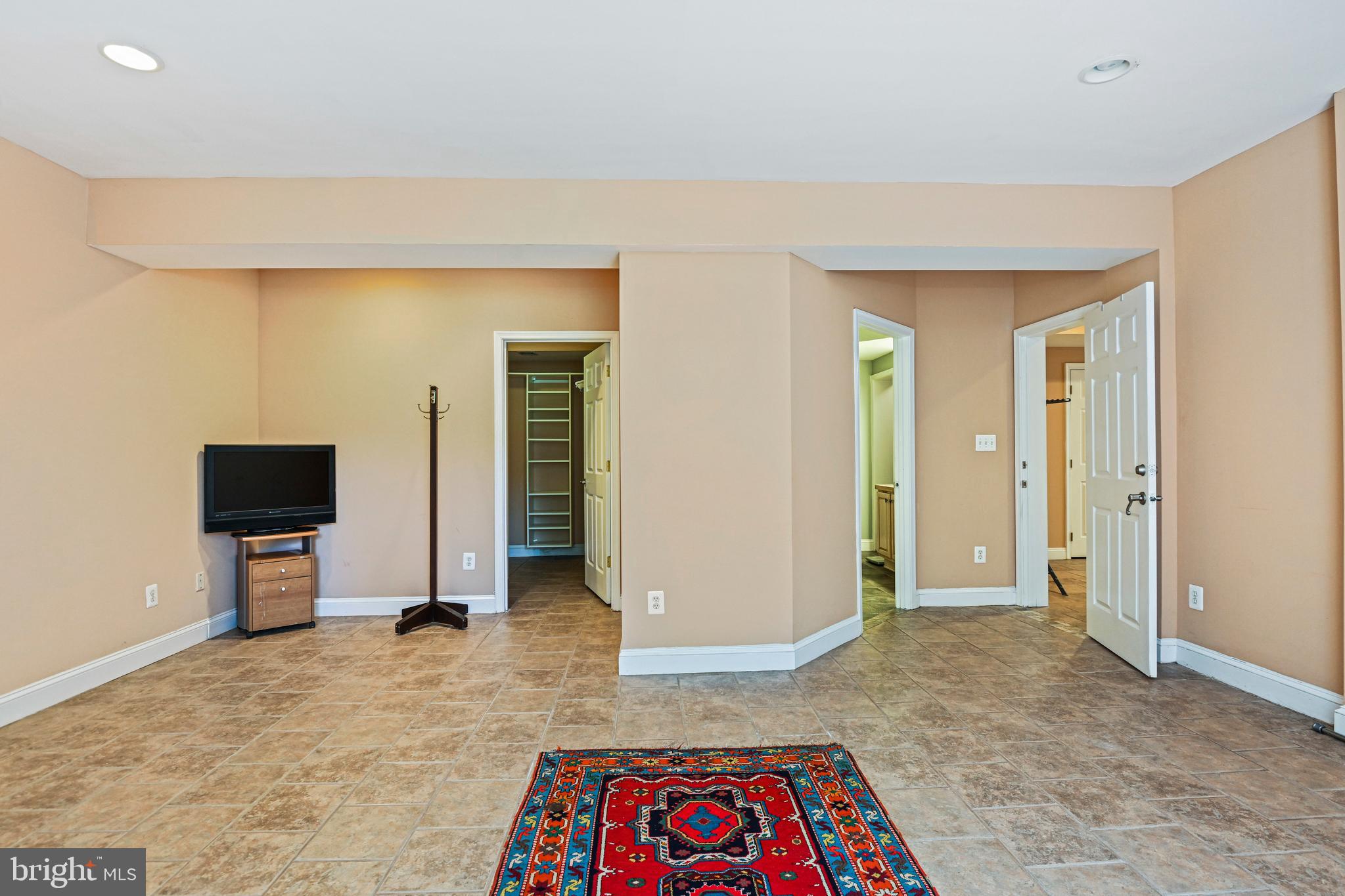 10509 Dunn Meadow Road Vienna, VA 22182 - Photo 56 of 81 a view of an empty room and a bathroom with mirror