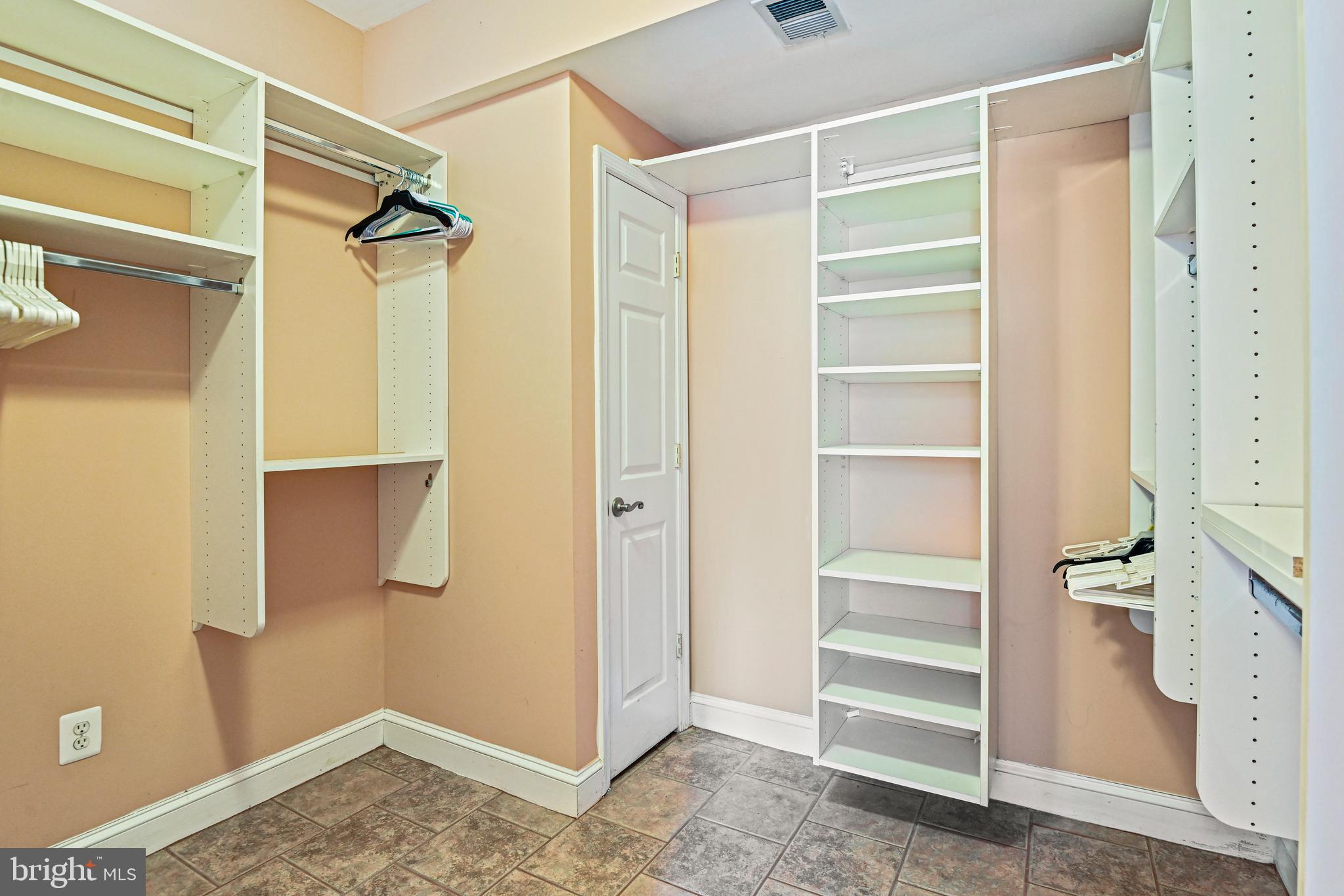 10509 Dunn Meadow Road Vienna, VA 22182 - Photo 57 of 81 a view of walk in closet with empty racks