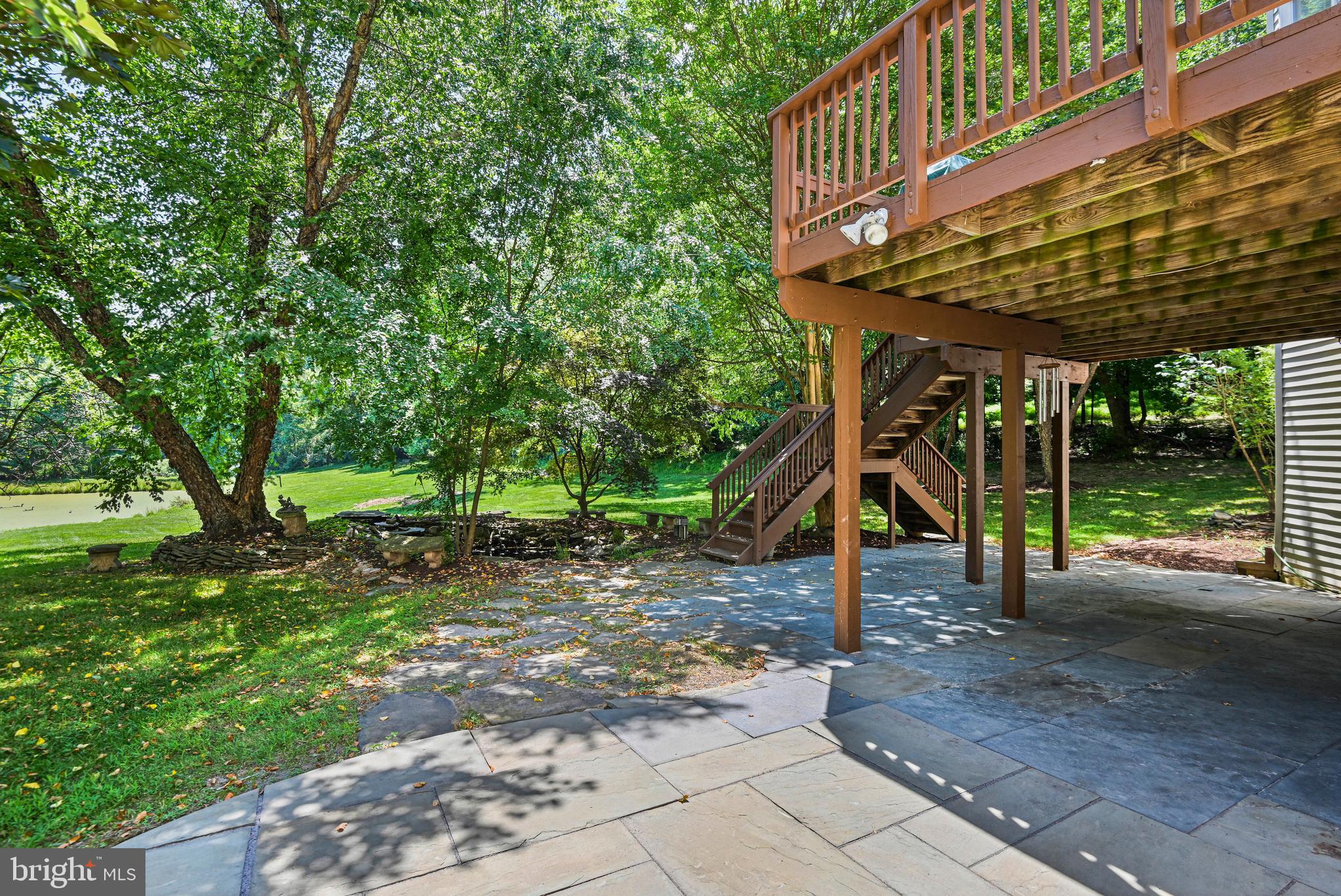 10509 Dunn Meadow Road Vienna, VA 22182 - Photo 65 of 81 a view of a patio with a table and chairs