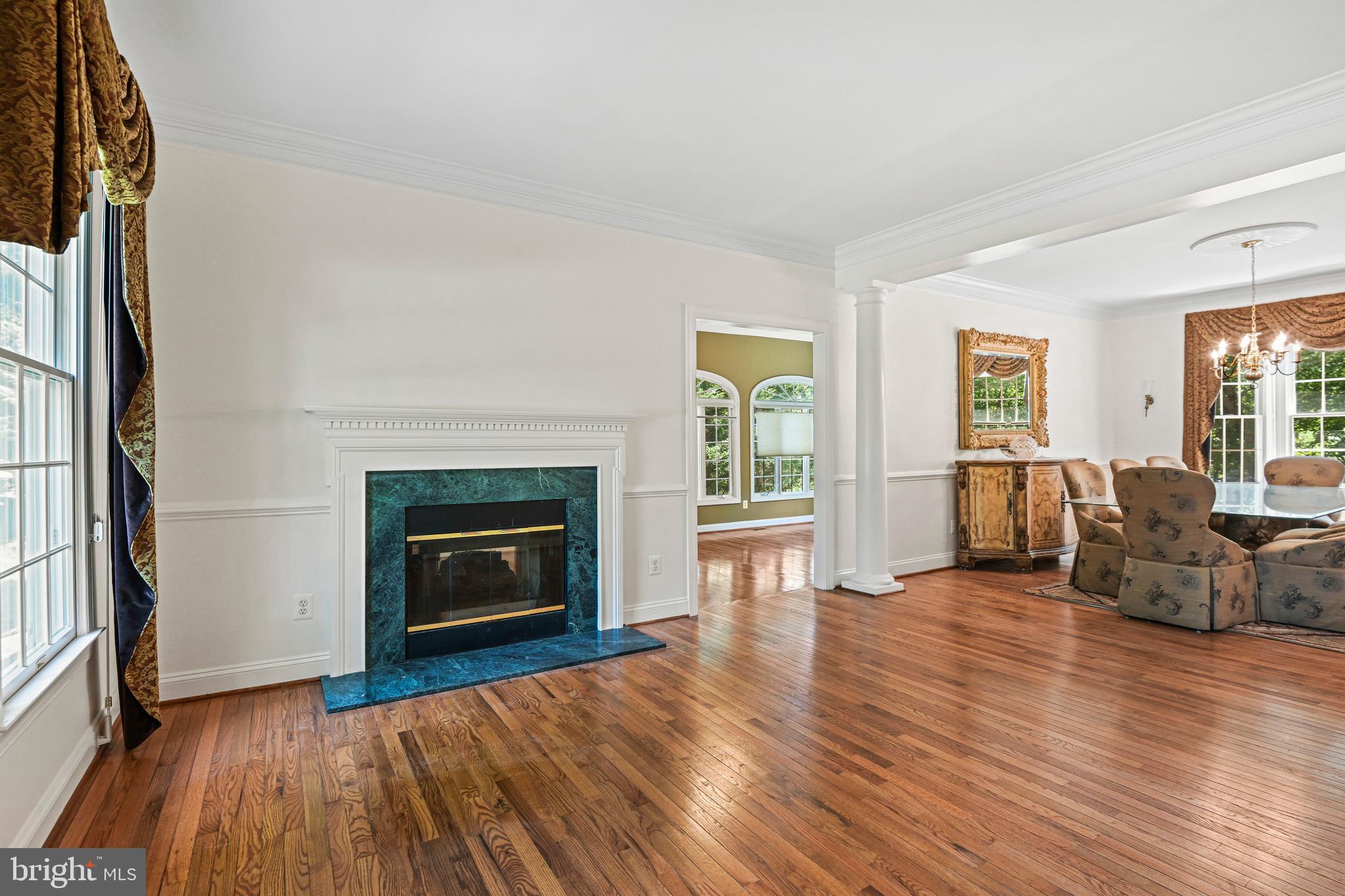 10509 Dunn Meadow Road Vienna, VA 22182 - Photo 7 of 81 a living room with furniture and a fireplace