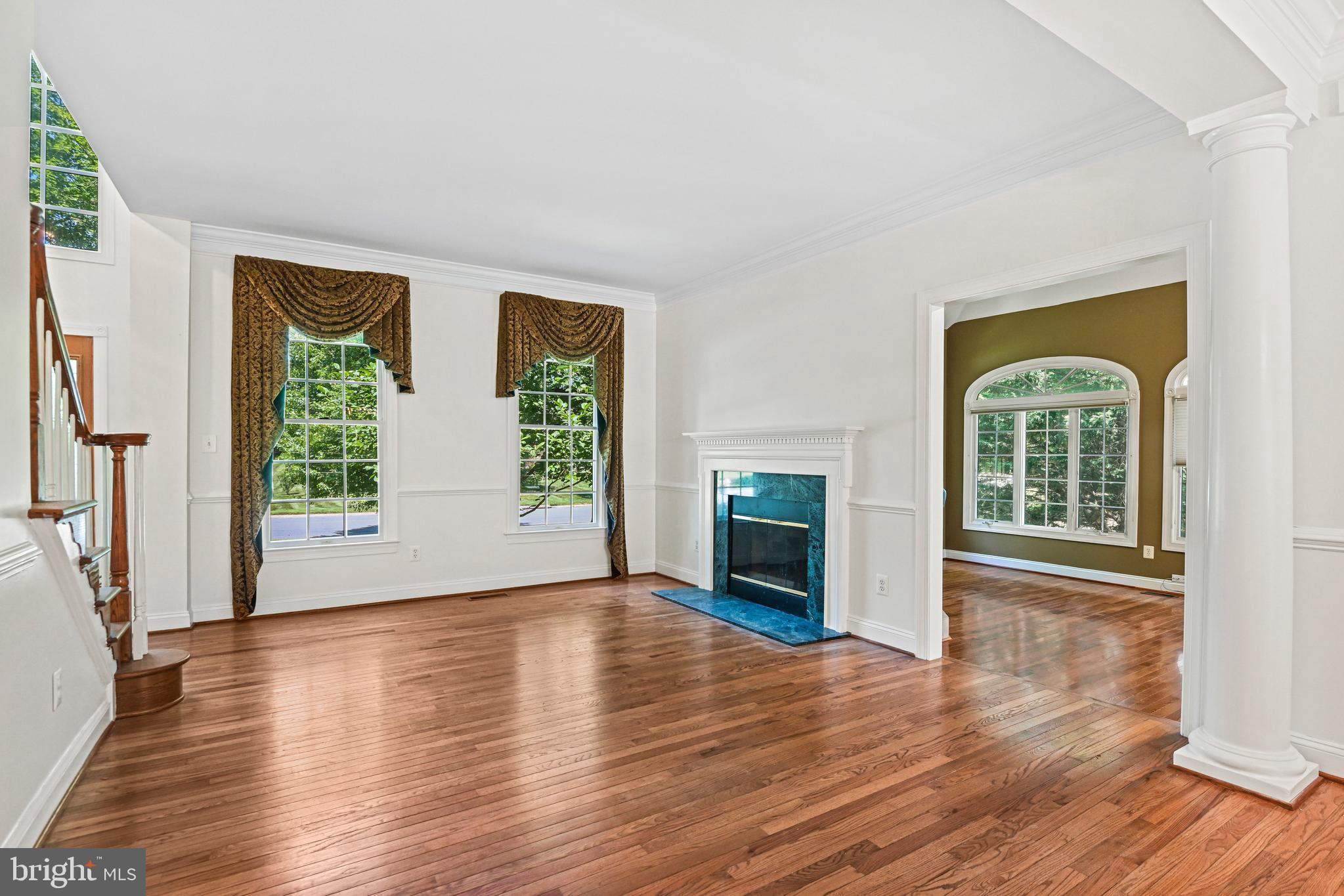 10509 Dunn Meadow Road Vienna, VA 22182 - Photo 8 of 81 a view of an empty room with wooden floor and a window